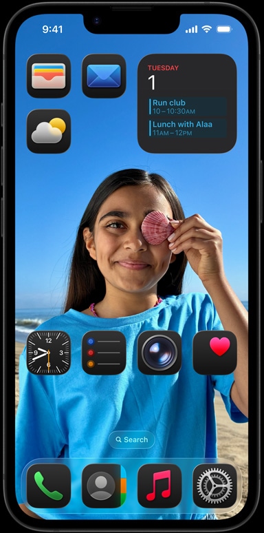 iPhone 16e surrounded by apps like Apple mail, WhatsApp, Safari, Apple maps, Apple Music, photos, notes and home